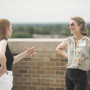 Two Athena in Action participants on the balcony