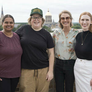 Four Athena in Action participants on the balcony