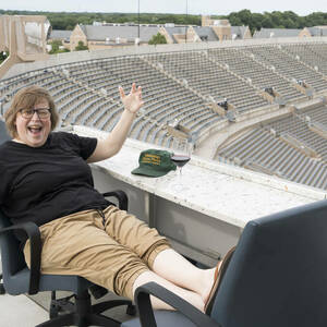 Photo of Athena in Action participant on balcony