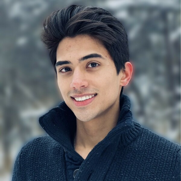 Headshot of Matthew in black fleece jacket.